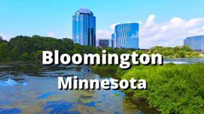 Buildings with a picture of the skyline, Foliage and body of water 